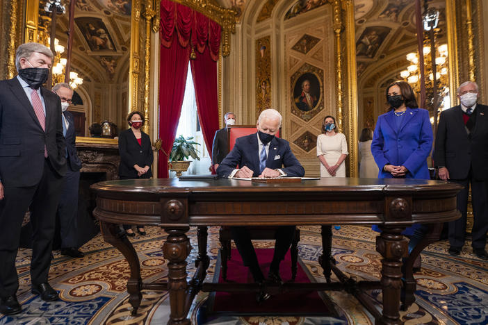 President Joe Biden signs three documents including an inauguration declaration, cabinet nominations and sub-cabinet nominations in the President's Room at the US Capitol after the inauguration ceremony, Wednesday.