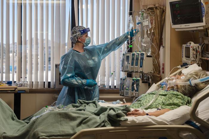 A nurse tends to a Covid-19 patient in the intensive care unit at Providence St. Mary Medical Center in Apple Valley, Calif., on Jan. 11.