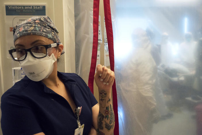 Maria Arechiga, an ICU charge nurse, monitors the progress of two COVID-19 patients in the intensive care unit of Martin Luther King Jr. Community Hospital in Los Angeles.