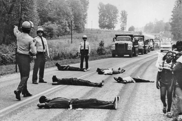 Protesters attempt to block the delivery of toxic PCB waste to a landfill in Warren County, N.C., in 1982. It was in response to the state's decision to locate a hazardous waste landfill in a low-income, predominantly Black area of Warren County that the term "environmental racism" was first used by the Rev. Ben Chavis.