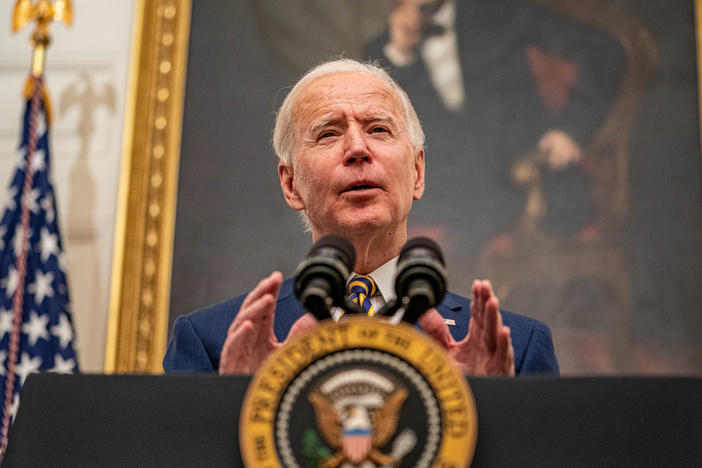 President Biden speaks on his administration's response to the economic crisis in the State Dining Room of the White House on Friday.