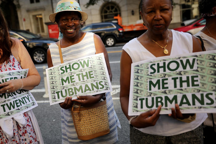 Supporters rally outside the U.S. Treasury Department in 2019 to demand that American abolitionist Harriet Tubman's image be put on the $20 bill.