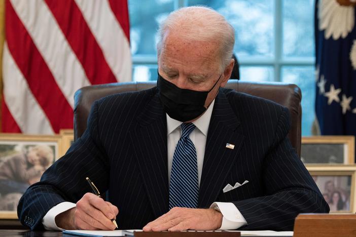 President Biden signs an executive order Monday reversing a Trump-era ban on transgender people serving in the military.
