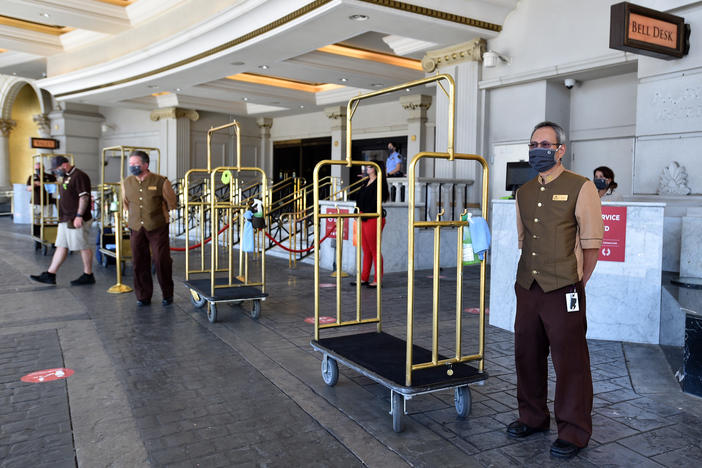 Hotel staff stand ready to receive guests on June 4, 2020, at Caesars Palace in Las Vegas. U.S. hotels hit all-time lows in occupancy and in revenue per available room last year.