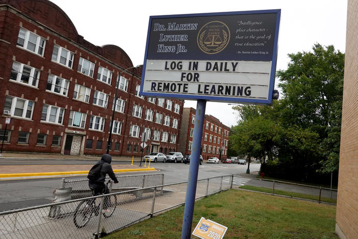 The Chicago Teachers Union voted on Sunday to continue remote work only, in defiance of the school district's plans for K-8 teachers and staff to return to classrooms this week. Here, a sign in front of Martin Luther King, Jr. Elementary School in September.