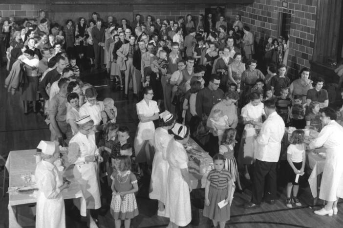 Residents of Protection, Kan., gathered in the high school gym to receive polio shots on April 2, 1957. The mass inoculation event was staged by the March of Dimes, then known as the National Foundation for Infantile Paralysis.