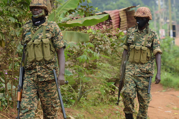 Soldiers patrol outside presidential challenger Bobi Wine's home in Magere, Kampala, Uganda, Jan. 16, after President Yoweri Museveni was declared the winner of the election.