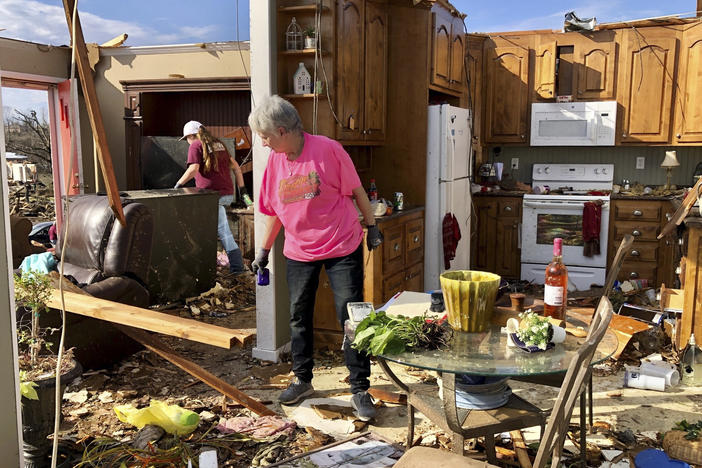 Patti Herring sobs as she sorts through the remains of her home in Fultondale, Ala., on Tuesday, after her house was destroyed by a tornado.