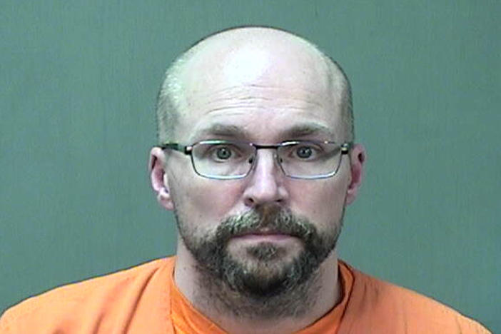 Steven Brandenburg at the Ozaukee County Sheriff's Office Monday, in Port Washington, Wis. Brandenburg agreed to plead guilty to two charges of of attempting to tamper with consumer products with reckless disregard for the risk that another person will be placed in danger of death or bodily injury, prosecutors say.