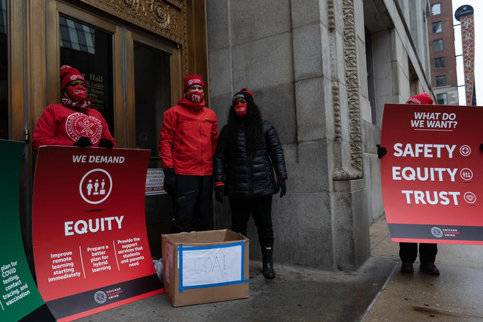 Chicago Teachers Union leaders appear outside City Hall with a list of their demands and a box of coal in December. As of Tuesday, the union has failed to reach an agreement with Chicago Public Schools on a return to in-person learning.