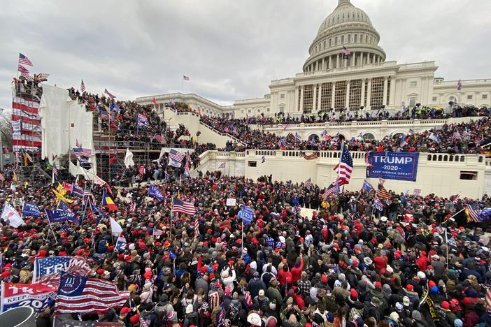 Pro-Trump extremists attacked the U.S. Capitol on Jan. 6. The acting U.S. Capitol Police chief apologized to Congress Tuesday for the department's failure to secure the building.