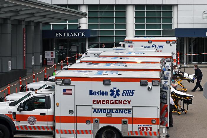 A Boston EMS ambulance crew wheels in a patient to MGH from their ambulance in Boston on April 8, 2020. Hospitals brace for a surge in patients.