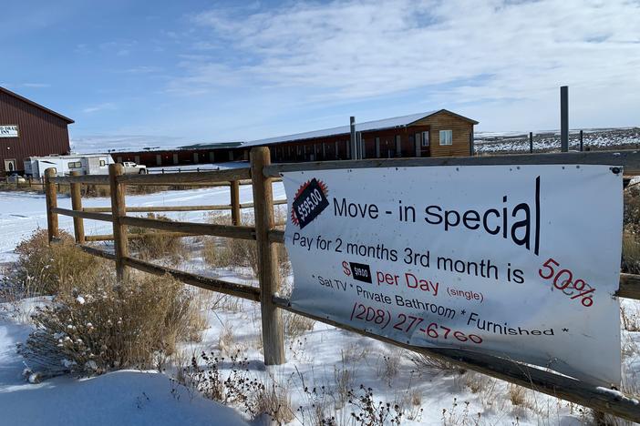 A sign in the Jonah Field advertises cheap rates at a deserted motel built for oil and gas workers.