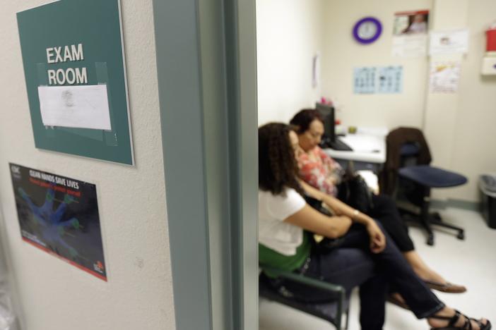 President Biden signed an executive action Thursday that revokes a Trump-era policy cutting funds to global organizations that offer abortion and to expand access to health insurance.