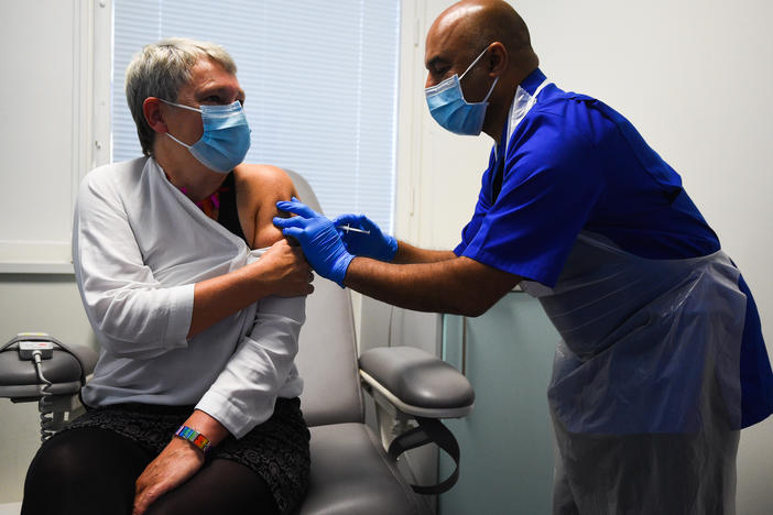 Nurse Vash Deelchand inoculated Kate Bingham, chair of the U.K. government's vaccine task force, with a Novavax vaccine at the Royal Free Hospital in London in October.