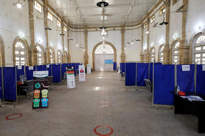 The Khaliq Dina Hall and Library building in Karachi, Pakistan, has been converted into a COVID-19 vaccination center.