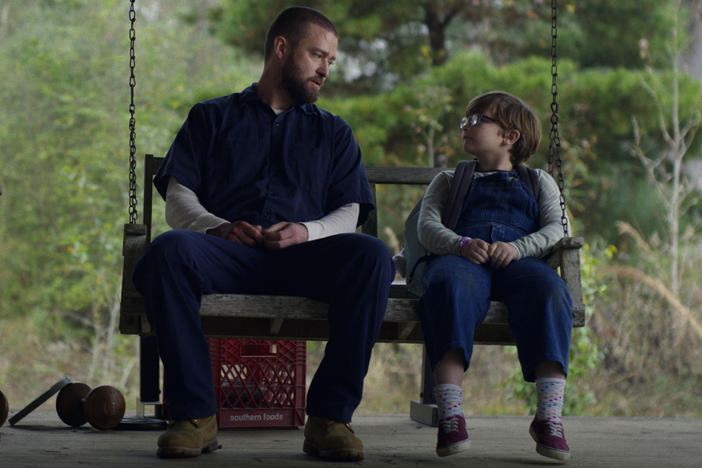 Justin Timberlake (left) and Ryder Allen star as Eddie and Sam in the new movie <em>Palmer </em>on Apple TV+.