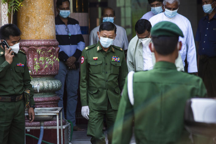 Myanmar's de facto leader, Aung San Suu Kyi, is charged with illegally importing walkie-talkie radios, in the first formal charges against her since the military ordered her detention. Here, a military commander visits a Hindu temple in Yangon.