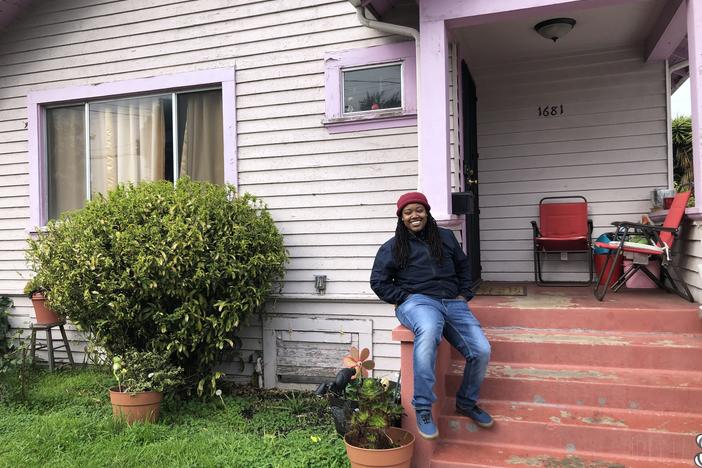 Marquita Price outside her grandmother's house in East Oakland. She worries that contaminated rising groundwater threatens the health of her family and their assets.