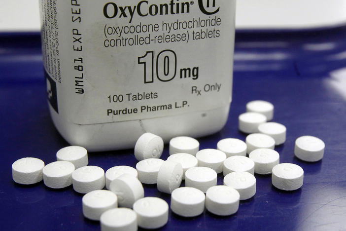 OxyContin pills arranged for a photo at a pharmacy in Montpelier, Vt. The global business consulting firm McKinsey & Company has agreed to a $573 million settlement over its role in the opioid crisis.
