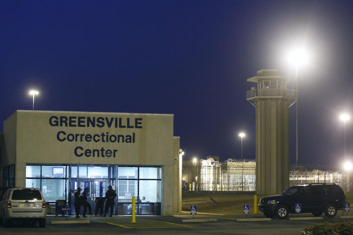 Prison guards stand outside the entrance to the Greensville Correctional Center where executions are carried out, in Jarratt, Va., on Sept. 23, 2010. This week, lawmakers in Virginia voted to abolished the death penalty.