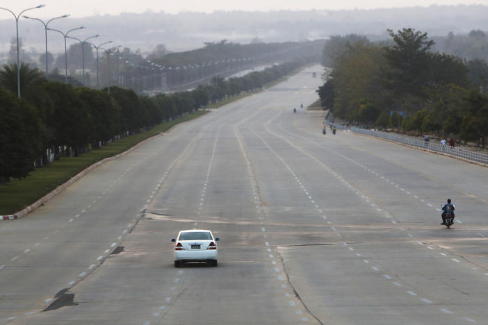 Vehicles make their way on a road in Naypyitaw, Myanmar, Feb. 1.