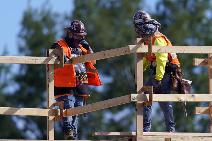 Construction workers are on the job in Simi Valley, Calif., earlier this week. Nationally, hiring resumed in January although the labor market still has a big hole to climb out of.