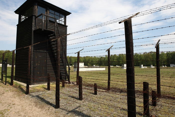A former typist and secretary at the Stutthof concentration camp in Poland is charged with being complicit in mass murder. The camp, seen here in 2016, has become a museum.