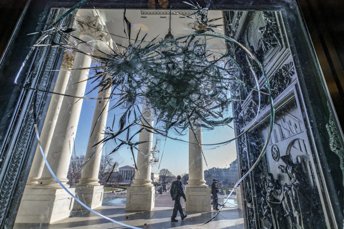 Shattered glass from the attack on the Capitol by a pro-Trump mob is seen in the doors leading to the Capitol Rotunda on Jan. 12.