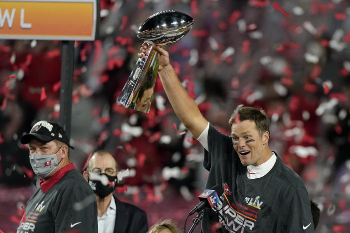 Quarterback Tom Brady celebrates with the Vince Lombardi Trophy after leading the Tampa Bay Buccaneers to Super Bowl victory against the Kansas City Chiefs on Sunday.