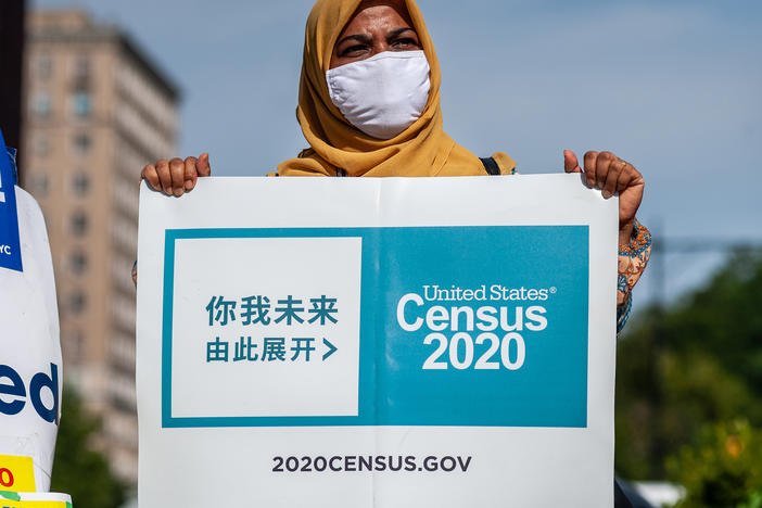 A census supporter holds up a sign during a 2020 rally in  New York City.