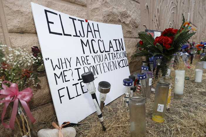 Three Aurora Police Department officers were fired in connection with staged photos wherein one officer held another in an apparent carotid restraint hold. That move was used to subdue Elijah McClain before he died.