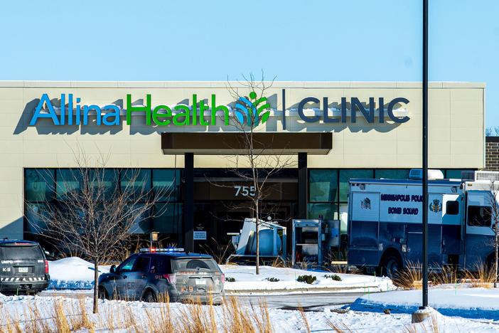 Police investigate the scene at Allina Health Clinic in Buffalo, Minn., on Tuesday after a shooting there.