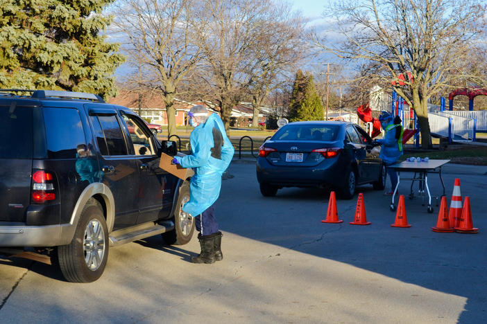 Before conducting the nasal swab test for COVID-19 at the Rantoul, Ill., clinic, researchers go out to greet each visitor and ask for basic identification and health information.