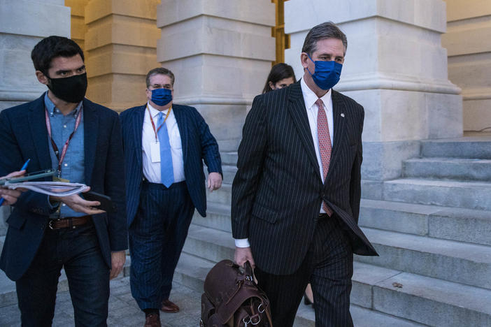 Bruce Castor, defense attorney for former President Donald Trump (center), departs the U.S. Capitol following the first day of the impeachment trial on Monday.