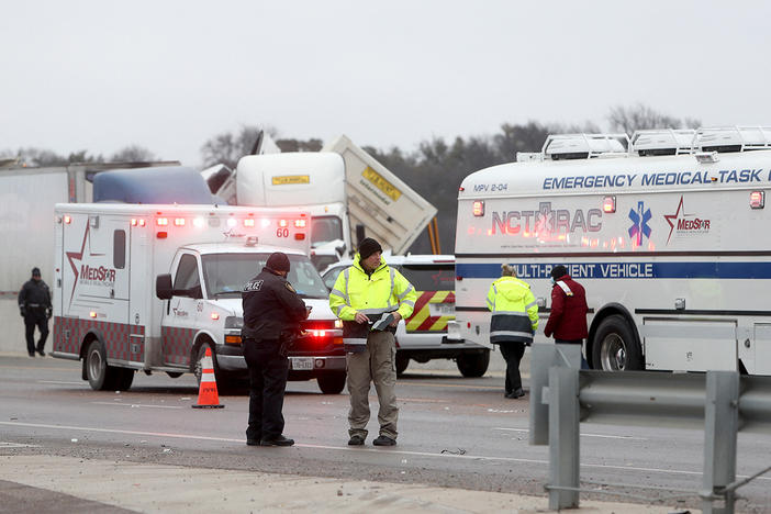 First responders arrive at the scene of a massive pileup of vehicles on Interstate 35W near downtown Fort Worth, Texas, on Thursday.