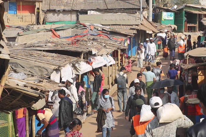 Rohingya refugees walk at the Balukhali refugee camp in Cox's Bazar, Bangladesh, on Feb. 2. Rohingya refugees from Myanmar living in camps in Bangladesh are condemning the military coup in their homeland and saying it makes them more fearful to return. A brutal counterinsurgency operation by Myanmar's military in 2017 drove more than 700,000 Rohingya Muslims to neighboring Bangladesh.