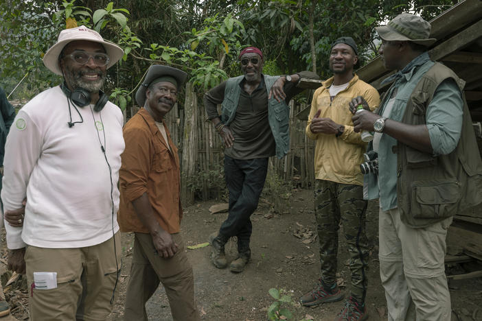 Spike Lee (left) consults with actors Clarke Peters, Delroy Lindo, Jonathan Majors and Norm Lewis on the set of <em>Da 5 Bloods.</em>