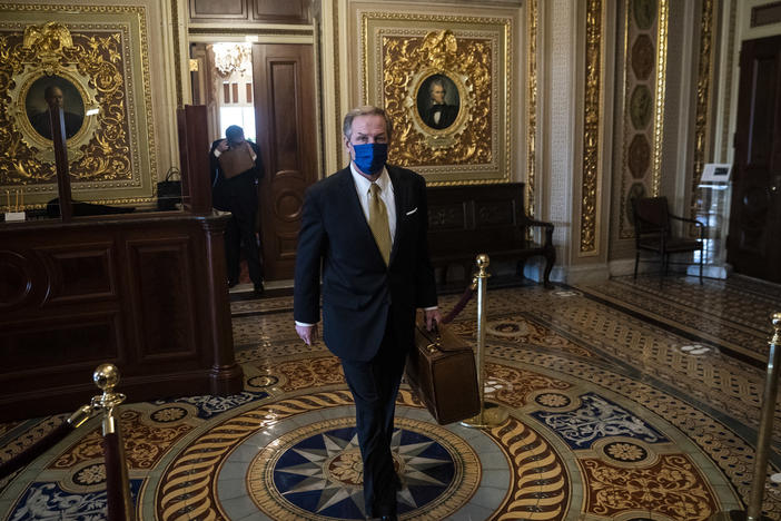 Michael van der Veen, lawyer for former President Donald Trump, walks to the Senate floor through the Senate Reception room on the fourth day of the Senate Impeachment trial for former President Donald Trump.