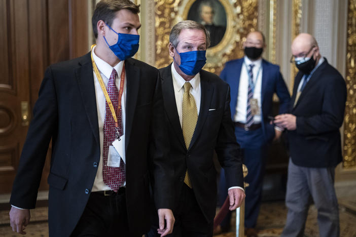 Michael van der Veen, lawyer for former President Donald Trump, walks to the Senate floor on the fourth day of the Senate impeachment trial, which had been expected to wrap up Saturday.