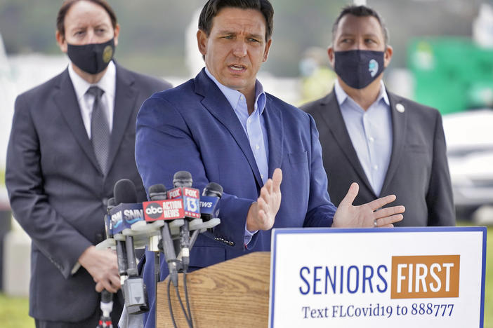 Florida Gov. Ron DeSantis speaks to the media at a COVID-19 vaccination site near the upscale Lakewood Ranch community in Bradenton, Fla., on Wednesday.