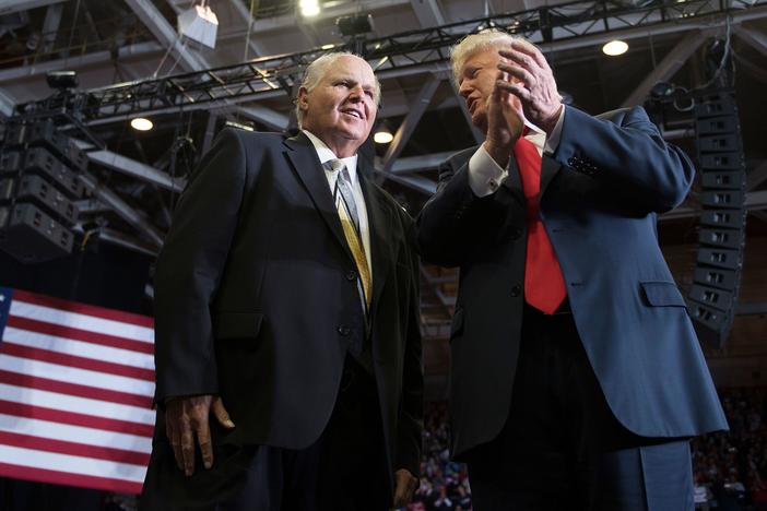 Talk show host Rush Limbaugh, pictured with then-President Donald Trump at a rally in November 2018, died on Wednesday.