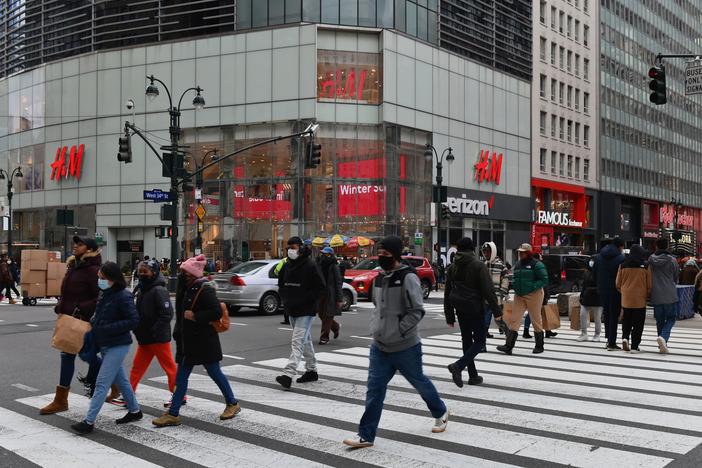 People walk in front of stores in New York's Herald Square. Retail sales soared 5.3% last month compared to December as U.S. families began receiving new federal coronavirus relief checks.