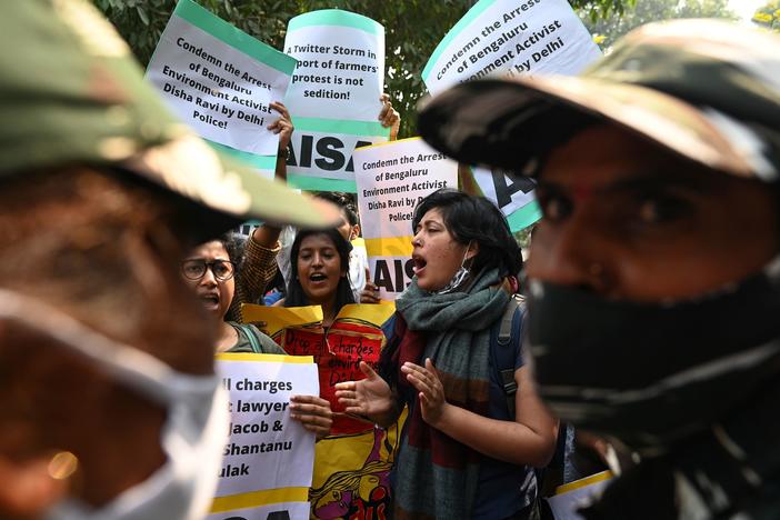 Demonstrators in New Delhi shout slogans during a protest against the arrest of climate change activist Disha Ravi for allegedly helping to create a guide for anti-government farmers protests.