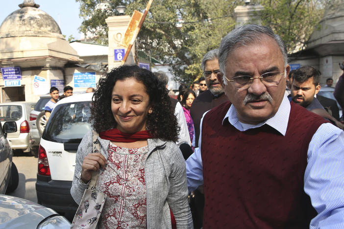 Indian journalist Priya Ramani (left) smiles as she leaves Patiala House Court in New Delhi in 2019. A New Delhi court on Wednesday acquitted Ramani of criminal defamation after she accused a former editor-turned-politician and junior external affairs minister, M.J. Akbar, of sexual harassment.