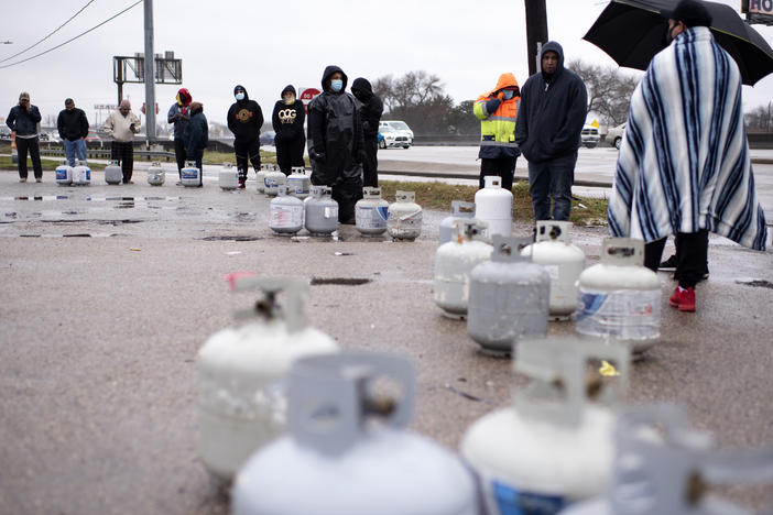 People in Houston wait in line to fill their propane tanks on Wednesday amidst widespread power outages related to the winter storm. Cases of carbon monoxide poisoning in the state have increased in recent days, with officials attributing most to the improper use of heating devices like charcoal grills and portable generators.