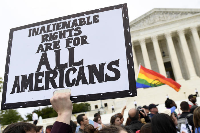 Protesters gather outside the Supreme Court in Washington where the Court on Oct. 8, 2019, as the court heard arguments in the first case of LGBT rights since the retirement of Supreme Court Justice Anthony Kennedy.