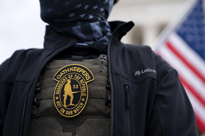 A demonstrator wears an Oath Keepers anti-government organization badge on a tactical vest during a protest outside the Supreme Court in Washington, D.C., on Jan. 5, 2021.