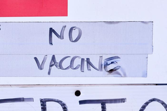 A sign at a vaccination site in Los Angeles reflects the holdup in vaccine distribution as a result of this week's storms. White House officials said Friday that the extreme weather delayed the shipment of some 6 million doses across the country.