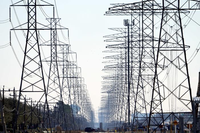 Power lines near Houston on Feb. 16. Some Texas residents are facing enormous power bills after wholesale prices for electricity skyrocketed amid last week's massive grid failure.